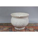 A lotus and acanthus leaf decorated carrera marble planter, 30 cm tall, 39 cm wide. Some wear and