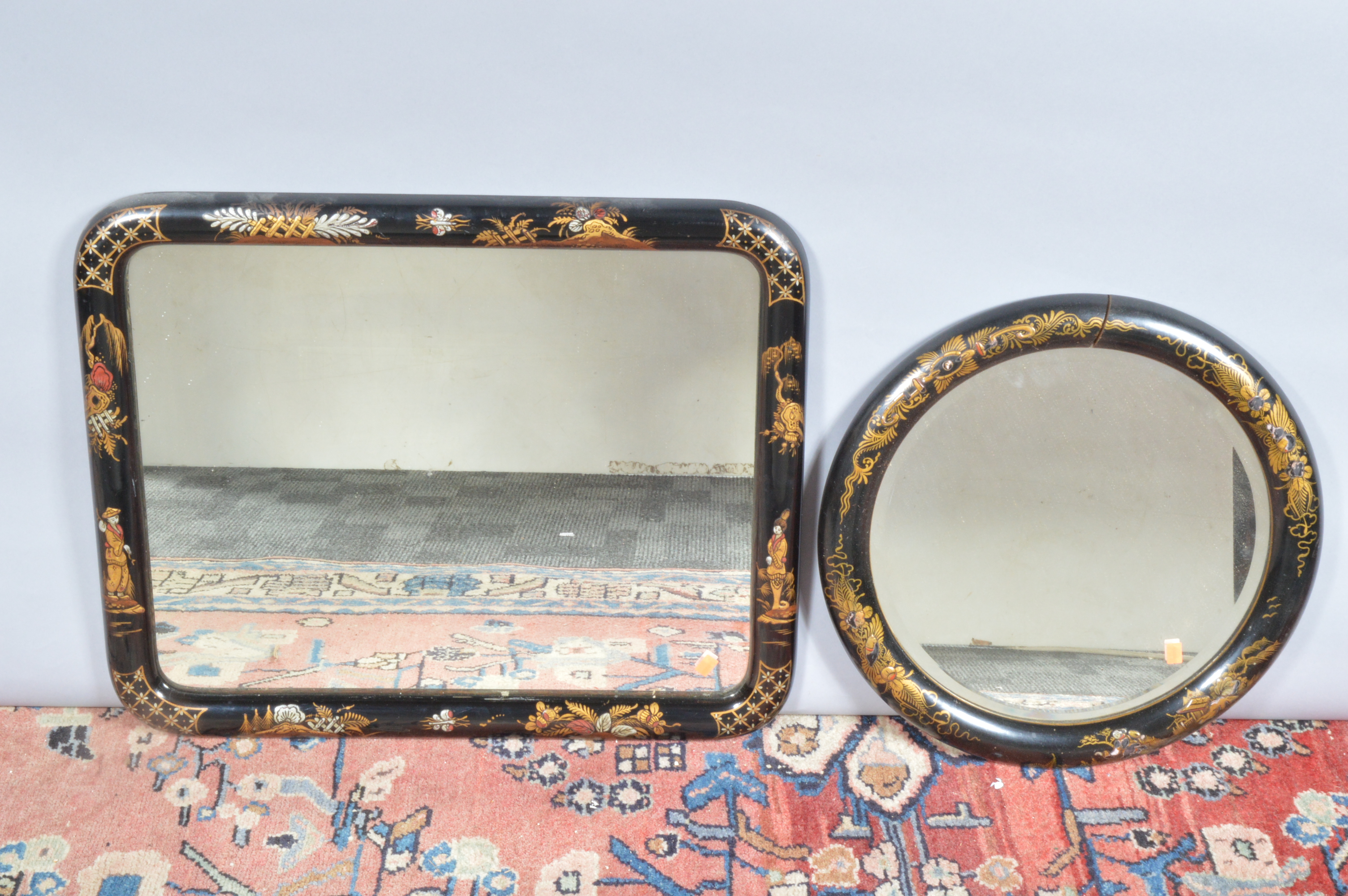 A pair of 20th century ebonised framed Chinoiserie mirrors, decoration in gilt, one rectangular