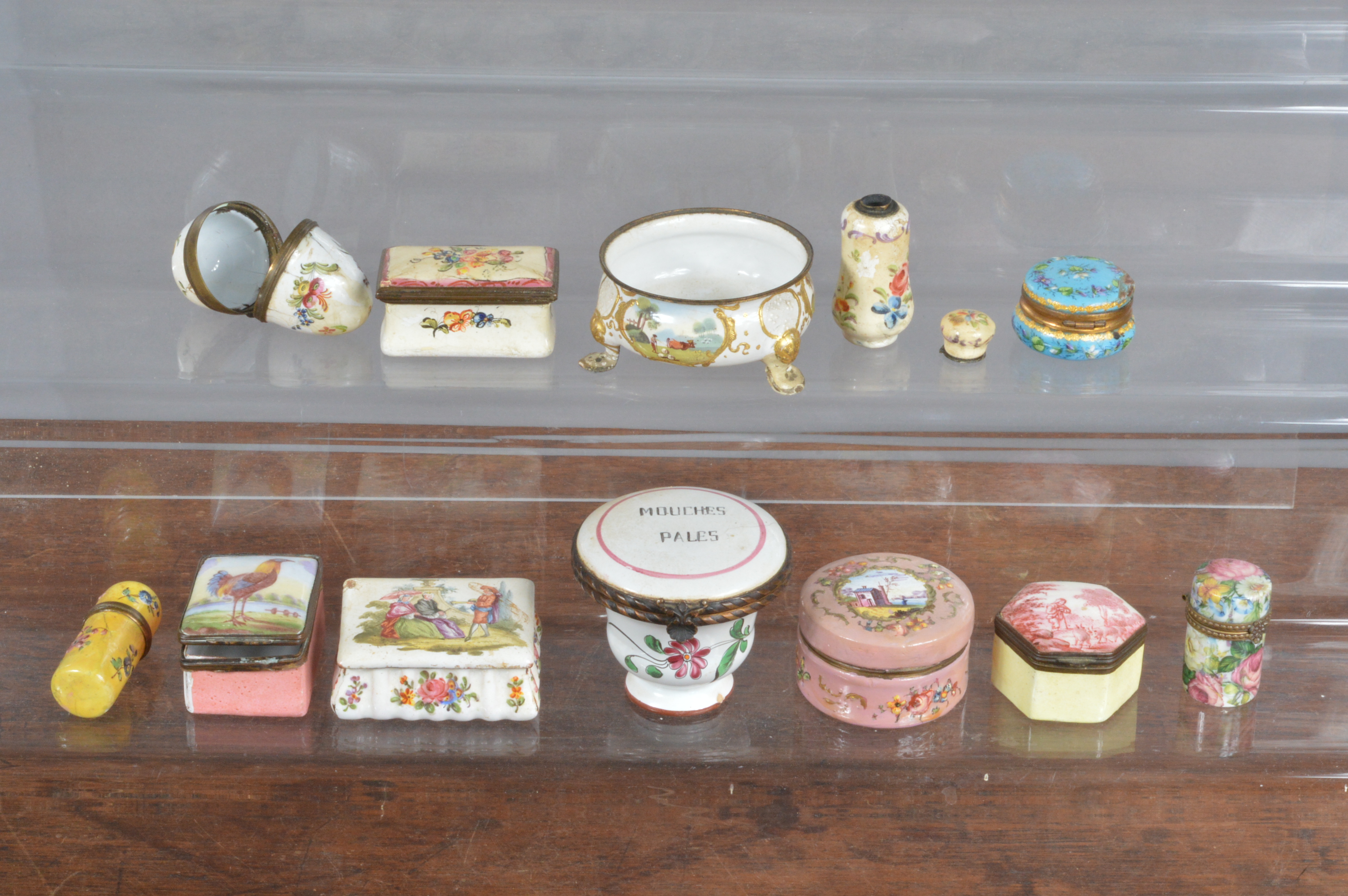 A collection of 18th and 19th century Continental enamel patch boxes, and some later examples,