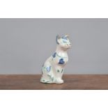 A French faience cat, decorated in blue and green with heart decoration on a white ground. 13 cm