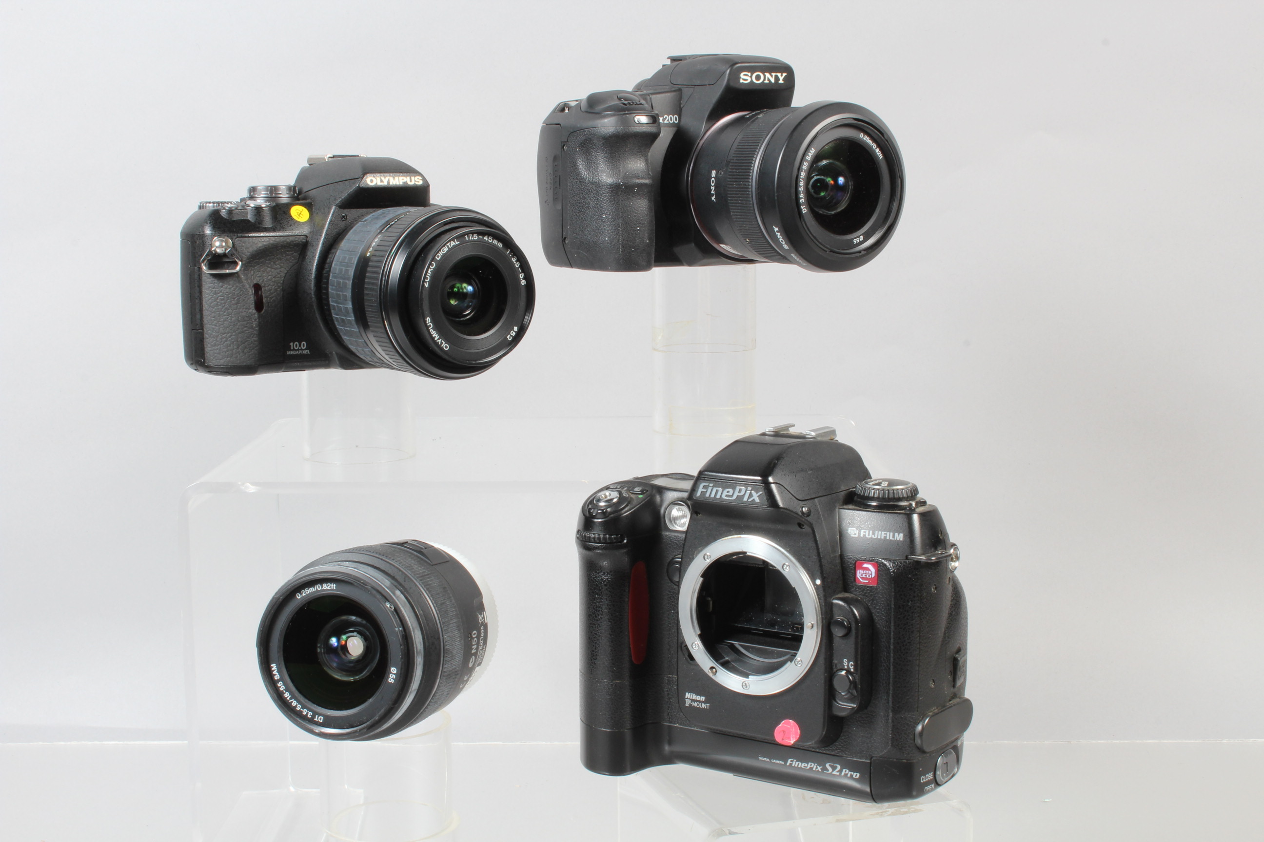 Three DSLR Cameras, a Sony Alpha 200,with two 18-55mm f/3.5-5.6 lenses, an Olympus E-410,with