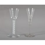 A 19th century wine or cordial drinking glass, with a spiralled stem, 14.5cm high, together with a
