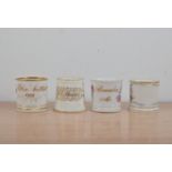 Four Victorian English porcelain mugs, all with painted floral decoration and heightened gilt
