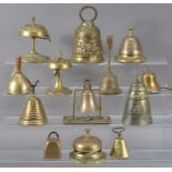 A large collection of 19th century and later brass hand and table bells, of differing designs and