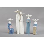 Four Lladro porcelain figurines, all of nuns, in various poses, the tallest a pair of nuns, 33cm
