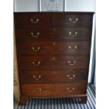 A 19th century tall oak chest of drawers, two short drawers over five drawers, brass handles and