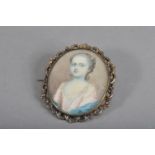 An 18th Century portrait miniature on ivory within gilt metal oval frame of a young girl, with