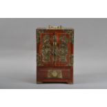 A 20th century Chinese hardwood and brass bound collectors cabinet, scrolling brass mounts, a