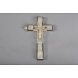 A late 19th century Jerusalem olive wood and mother of pearl crucifix, depicting Christ nailed to