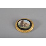 A 19th Century micro mosaic oval yellow metal brooch, the panel depicting the Colosseum at Rome