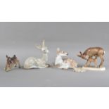 A collection of porcelain deer figurines, comprising two Lladro, Royal Copenhagen and two German