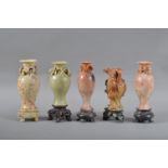 Five 20th century Chinese hardstone vases, of differing coloured stone, four with raised floral