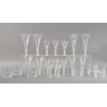A collection of cut glass, comprising swirl stemmed wine glasses, four large examples 19cm high,