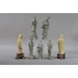 Seven 20th century Chinese carved hardstone figurines, five a dark green hardstone, two with