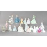 A large collection of ceramic lady figurines, comprising eleven Coalport examples, the tallest