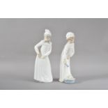 Two large Nao porcelain figurines, of two young children, both marked to the undersides, 29.5cm &