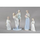 Three Nao porcelain figurines, comprising a large figural group of two dancers, 33cm high, a