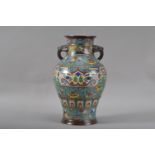 An early 20th century Chinese cloisonne and enamel twin handled vase, multi-coloured design, the