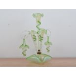 A damaged Victorian glass epergne, opalescent and clear glass base with green glass shaped rim, a