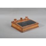 A 19th century olivewood and stoneware inkwell, two removable stoneware inkwells with a central