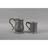 Two Victorian pewter tankards, the largest with a VR cypher and impressed 'Stuart', 16cm high, the