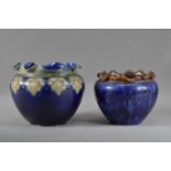 Two early 20th century Royal Doulton stoneware planters, both with scalloped shaped rims, the