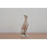 A Rosenthal porcelain figurine of a seated Greyhound, printed mark to the underside and impressed '