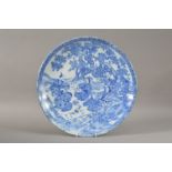 A mid 20th century Chinese blue and white charger, the design depicting figures in natural