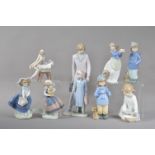 A collection of Lladro and Nao ceramic figurines, comprising three Lladro figurines, the tallest a