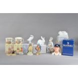 Four boxed Lladro figurines, comprising a child and a dog, 20cm high, two white rabbits and a