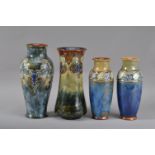 A collection of four Royal Doulton stoneware vases, comprising two taller art nouveau vases, of