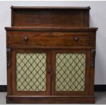 A 19th century mahogany secretaire cabinet, top shelf with a brass pierced gallery, raised with