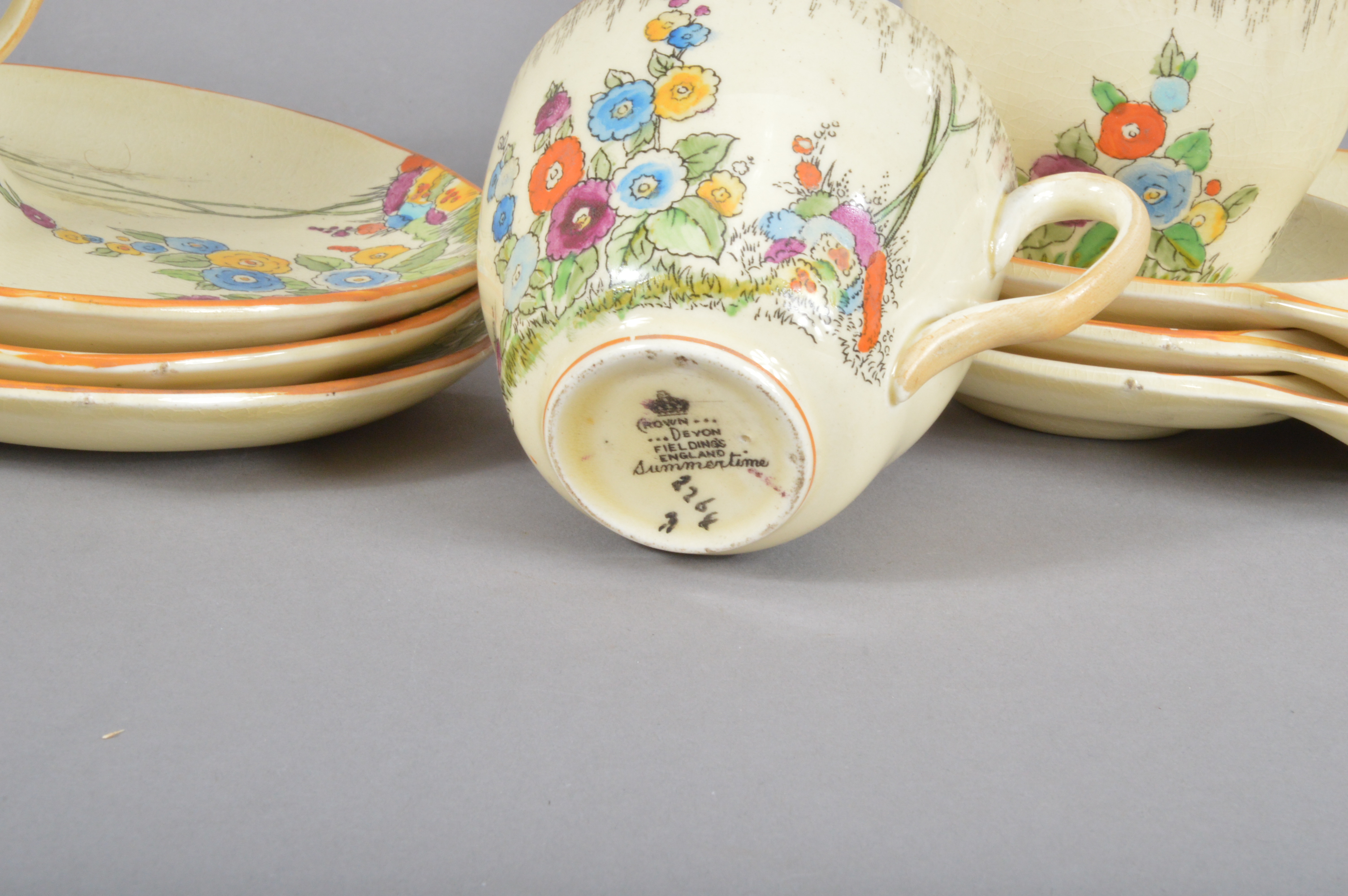 A set of six Crown Devon tea plates and cups, Summertime pattern, colourful decoration on a yellow/ - Image 2 of 2