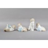 Four Nao porcelain cat figurines, three with balls of twine, all marked to the undersides, the