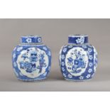 Two Chinese large porcelain ginger jars, both with prunus decoration on blue grounds, one with two