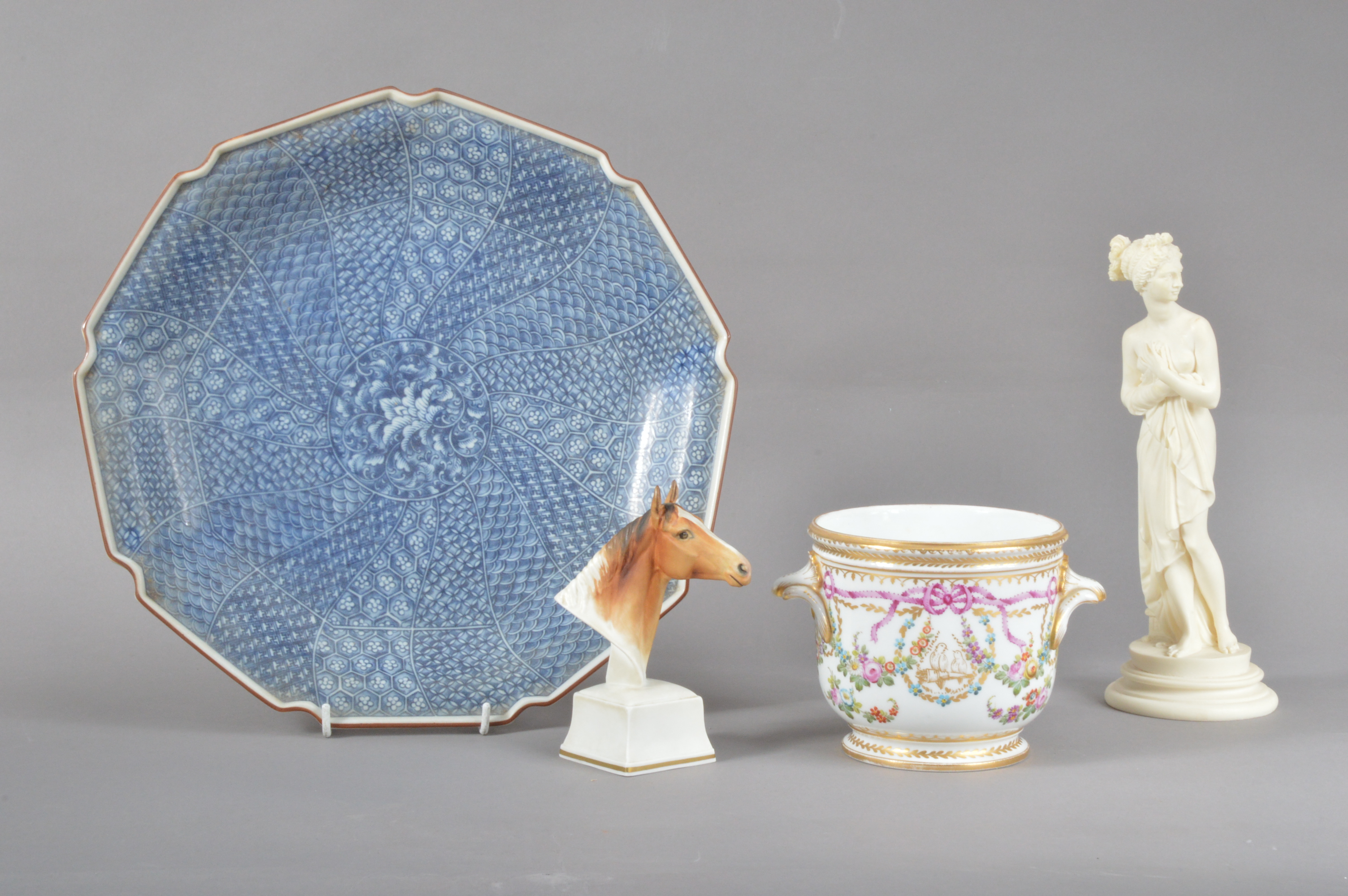 A 20th century large Chinese plate, with a shaped rim, blue and white floral design, the underside