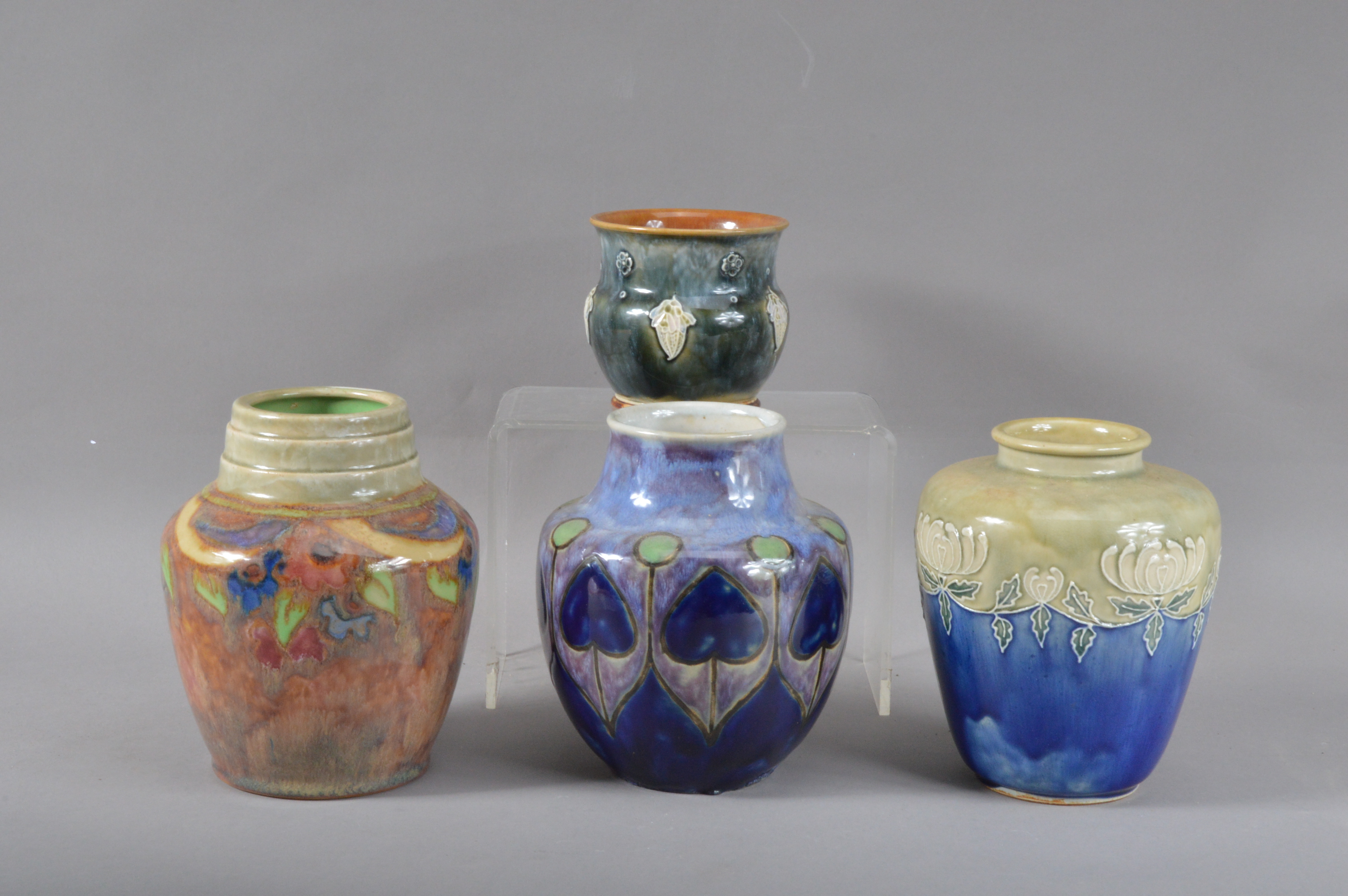 Three Royal Doulton stoneware globular vases, one with an art nouveau style, another incised D.