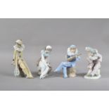 Four Nao porcelain figurines, all of jesters, in differing poses, the tallest 21cm high, all