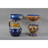 A collection of four Royal Doulton and Doulton Lambeth items, comprising a handled jug, 17cm high,