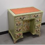 An early 20th century upcycled oak knee hole desk, painted green with an orange leather top,