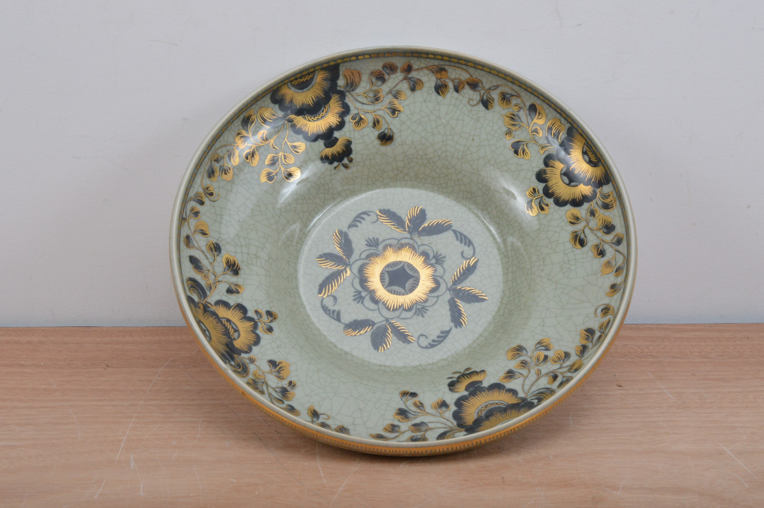 A large crackled glazed Royal Copenhagen bowl, green glaze with heightened gilt floral decoration,