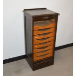 A 20th century wooden tambour fronted collectors cabinet, one draw missing, key present, some wear