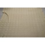 A large Cypriot crochet table cloth, beige colour, with a geometric pattern, with some small areas