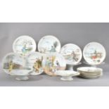 A 20th century porcelain dessert service, all with hand painted scenes with figures and gilt rims,