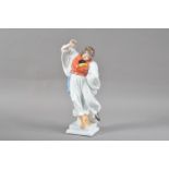 A Herend porcelain figurine of a dancing man, printed marks to the underside, numbered 5496, 29.