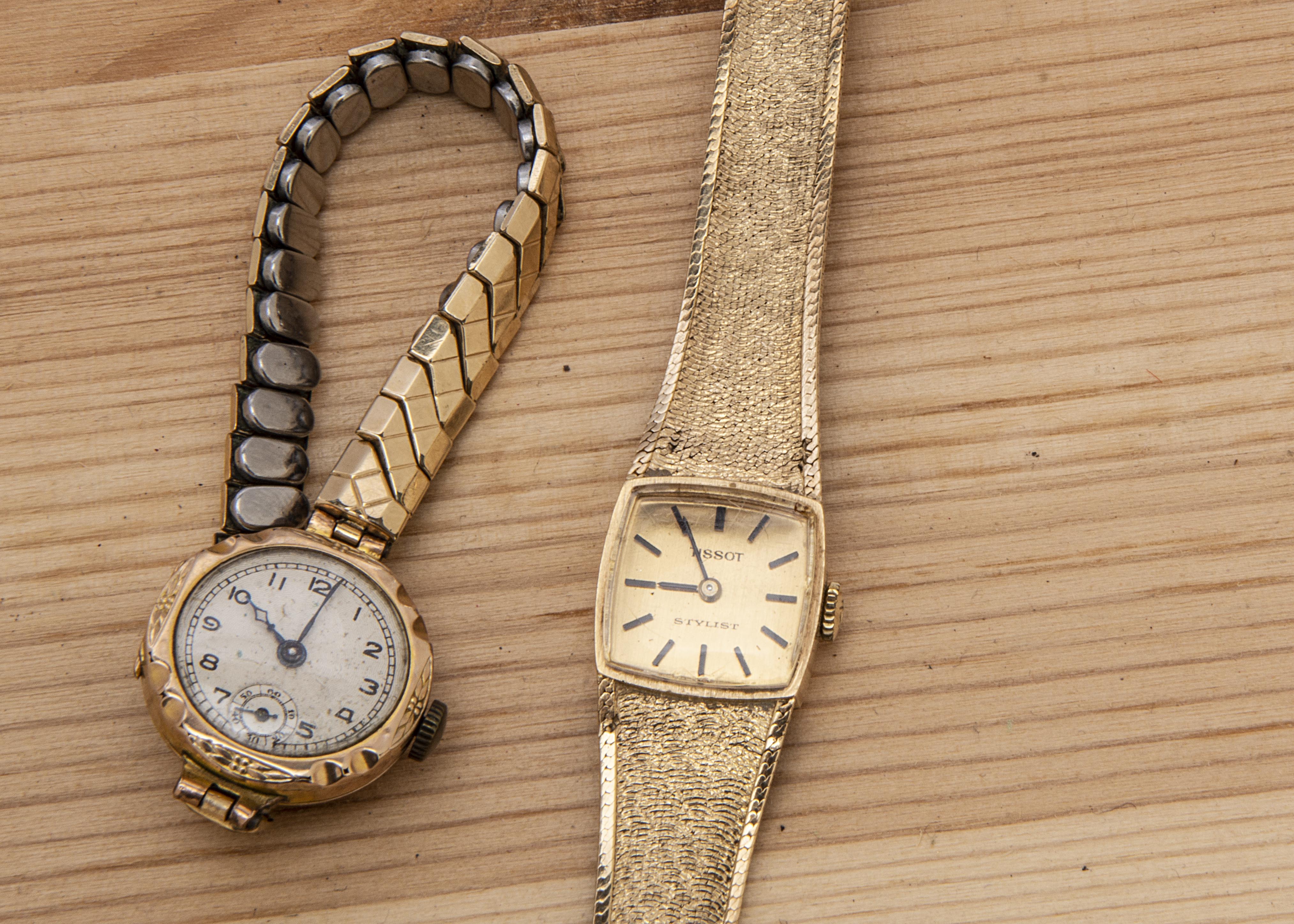 A c1970s Tissot 9ct gold lady's wristwatch, AF, 21.4g, with integrated strap, damaged, together with