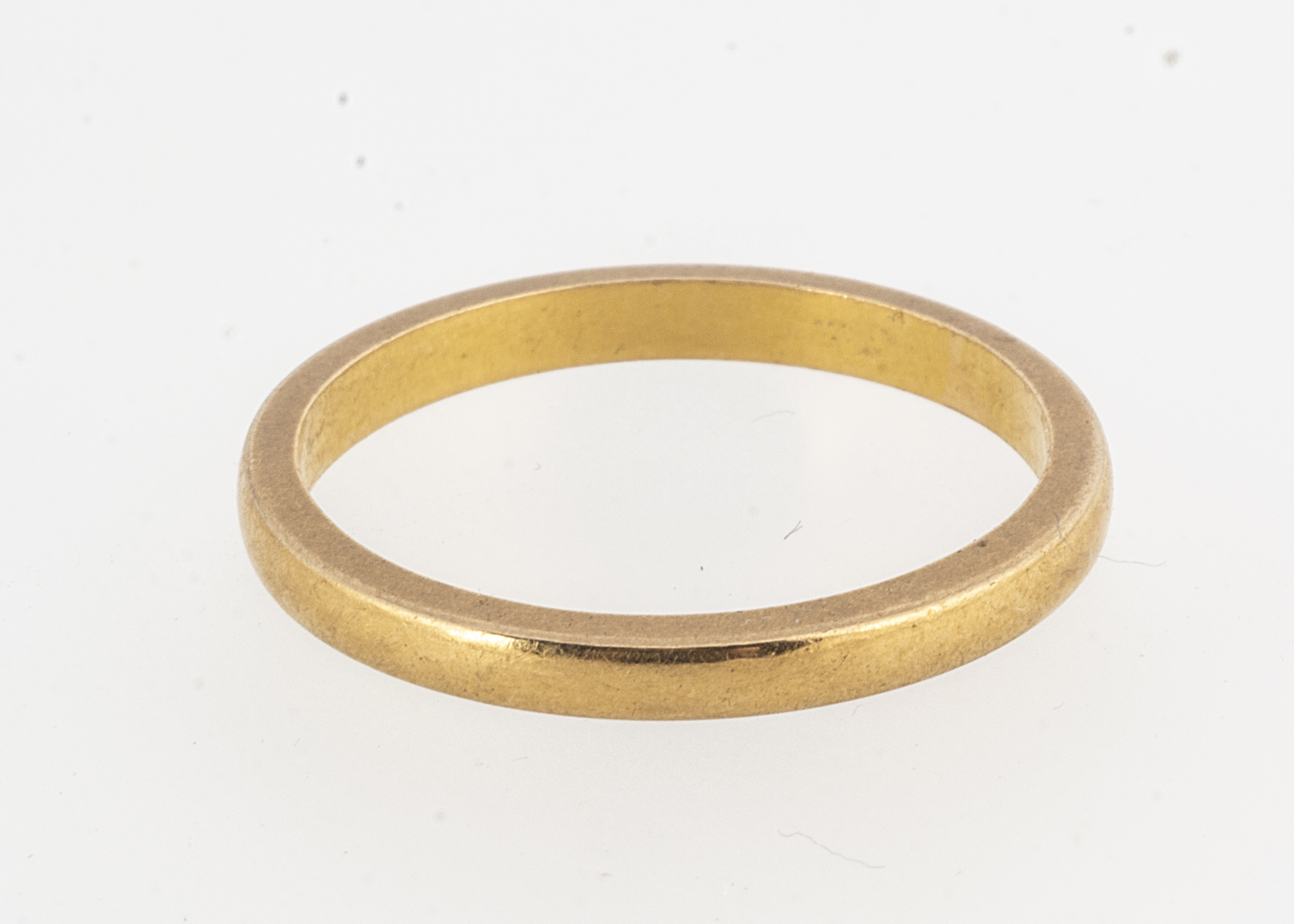 A 22ct gold court shaped wedding band, dated Birmingham 1948, 2.29mm, ring size P, 3.6g