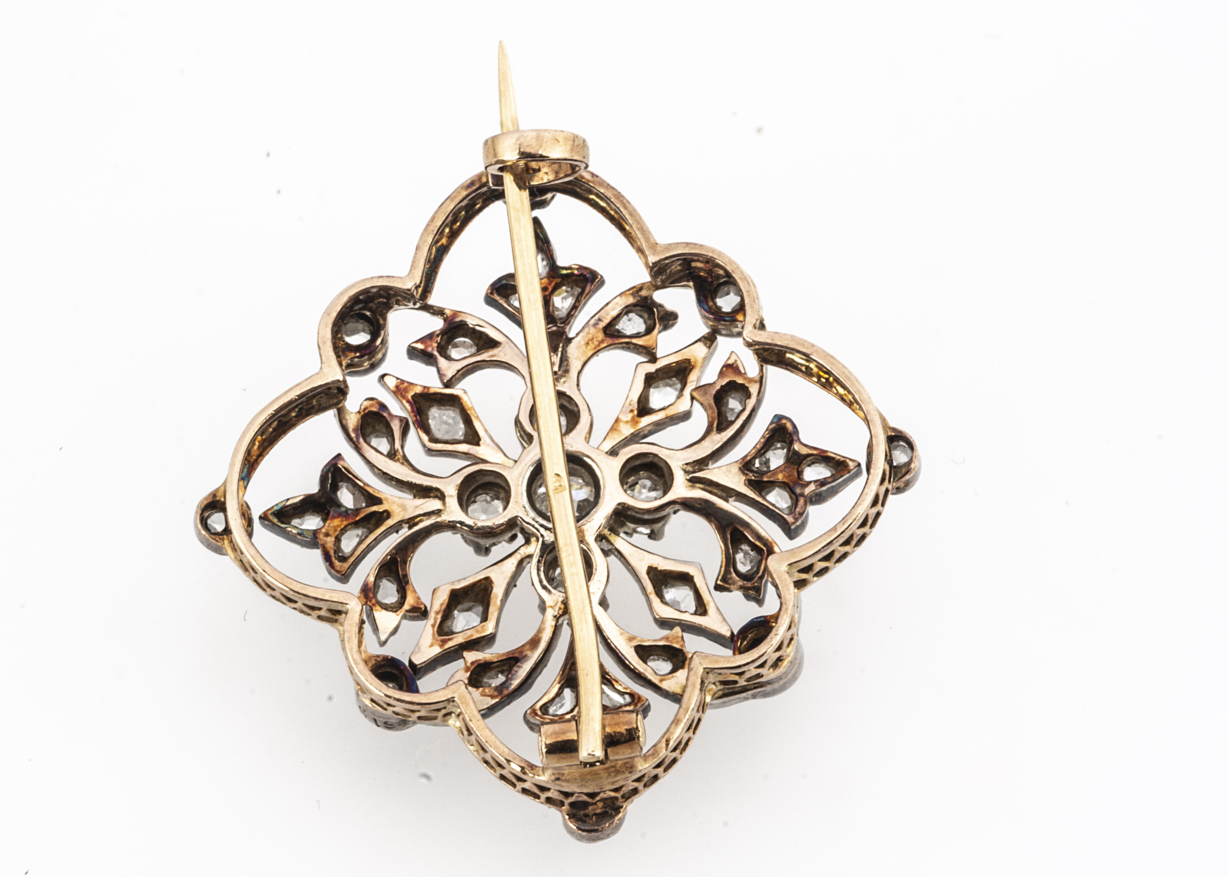 An early 20th century French open work brooch/pendant, of flower head design centred with an old cut - Image 2 of 2