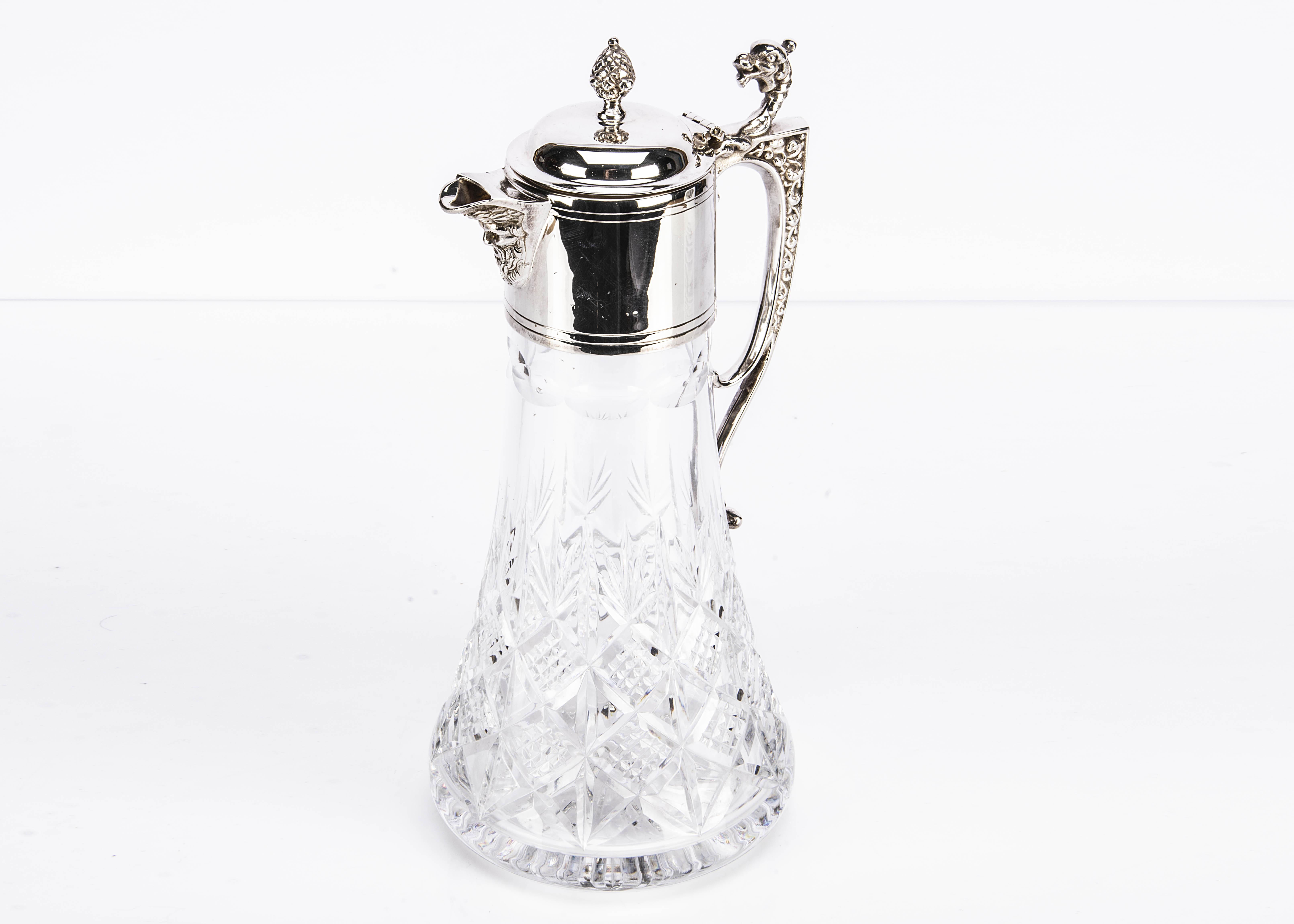 A modern cut glass and silver mounted claret jug from LRW, 29cm high, tapered cut glass body with