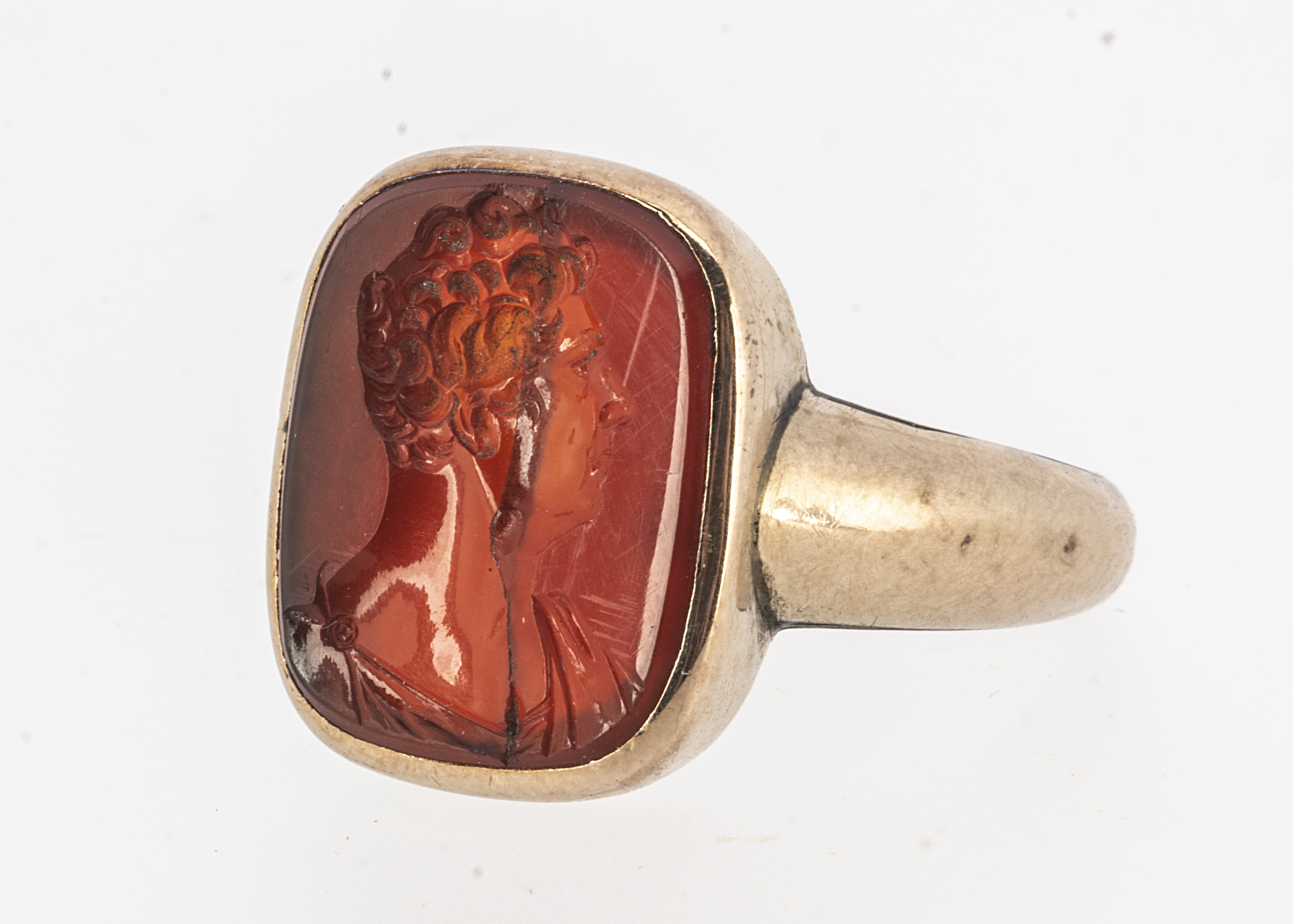 A Georgian carnelian intaglio signet ring, the cracked intaglio possibly an earlier Roman example